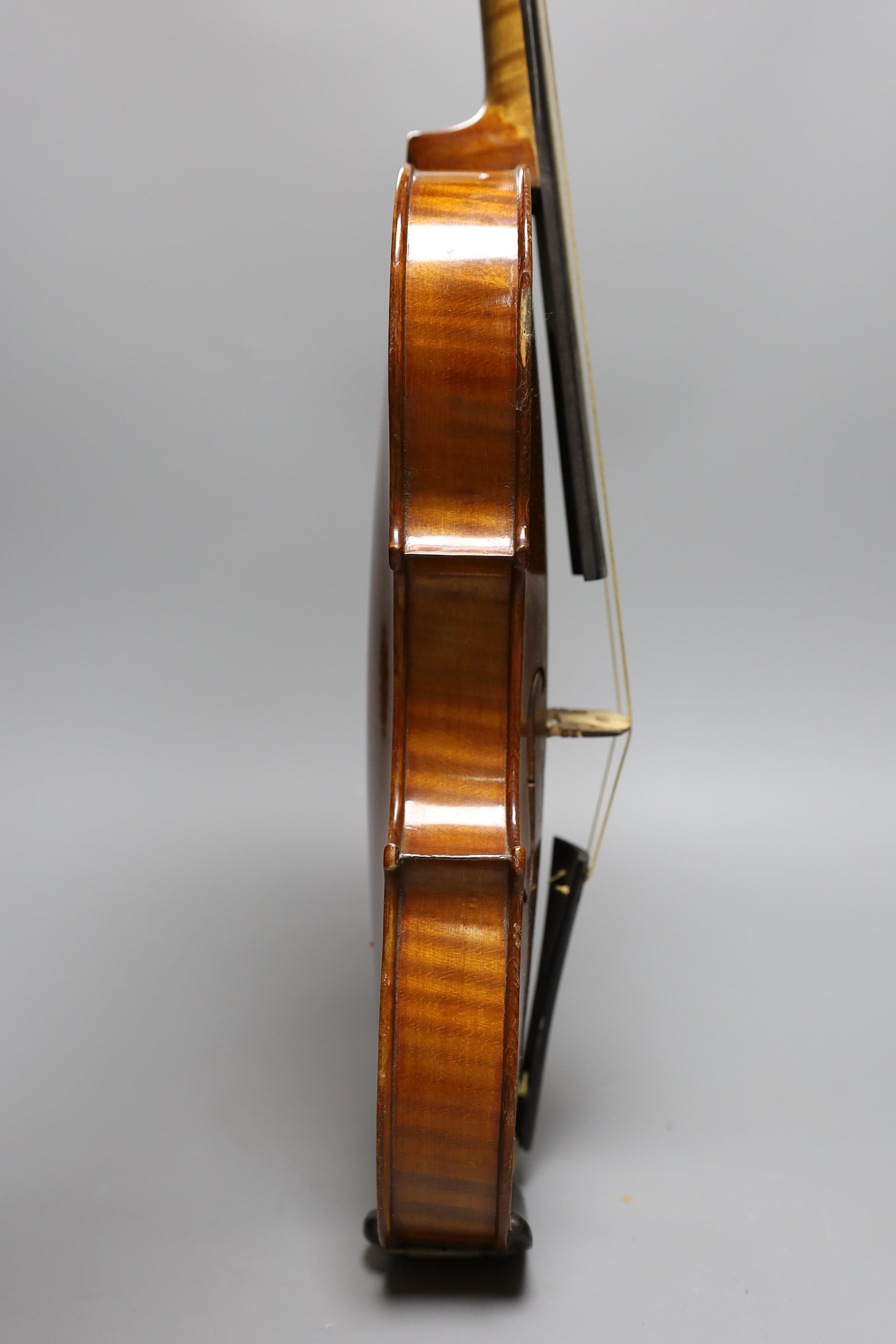 No labe and it is a full sized one.An early 20th century cased violin, length of back 36 cm